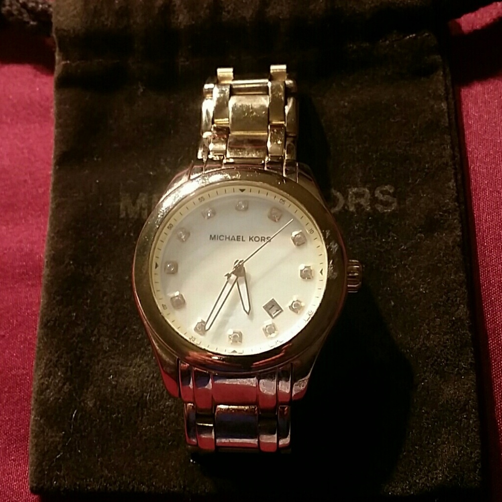 Authentic Michael Kors gold watch.